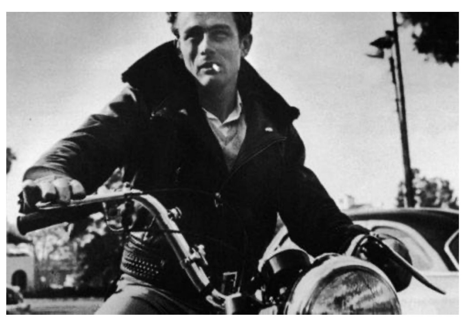 Classic black-and-white image of James Dean on a motorcycle